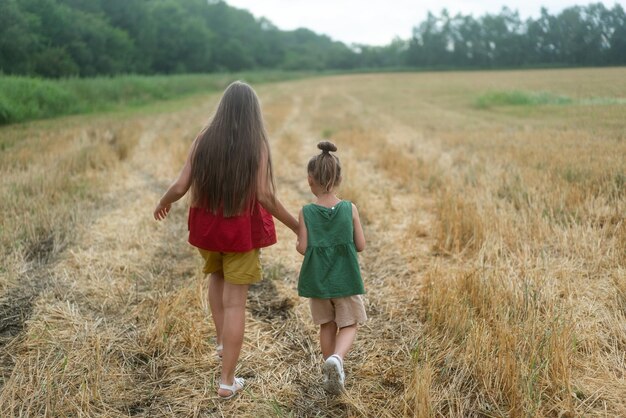 Girl in a hat and in a red dress sunbathes on the green grass No face High quality photo