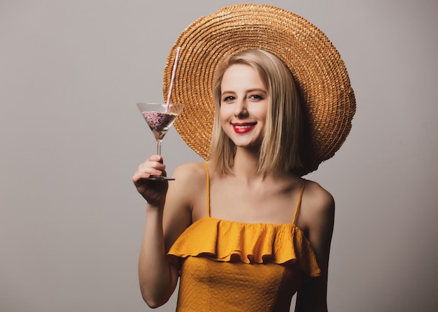 Girl in hat and yellow dress