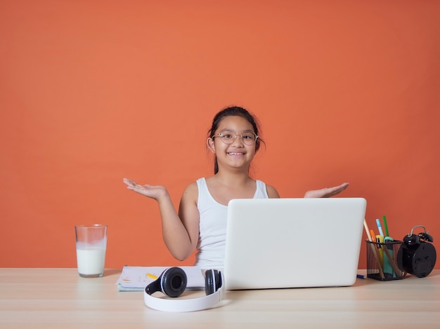 girl having online studying with laptop at home