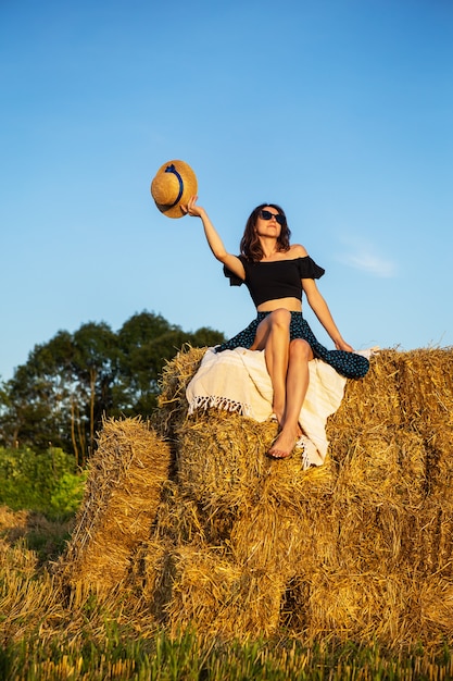 Girl on haystack