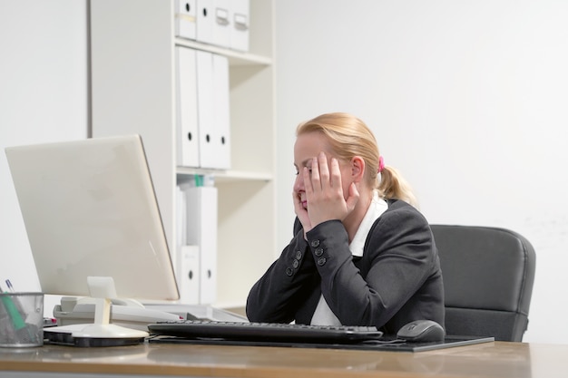 The girl headache. Girl squeezes her head