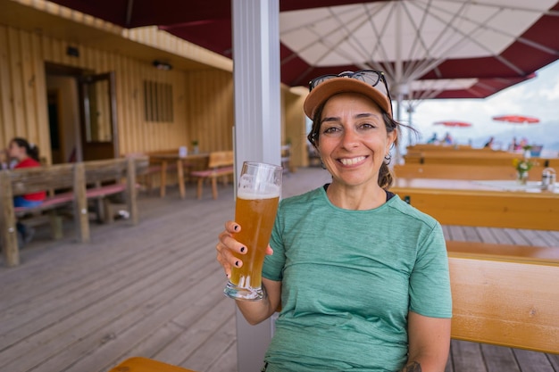 Girl hiker drinking beer