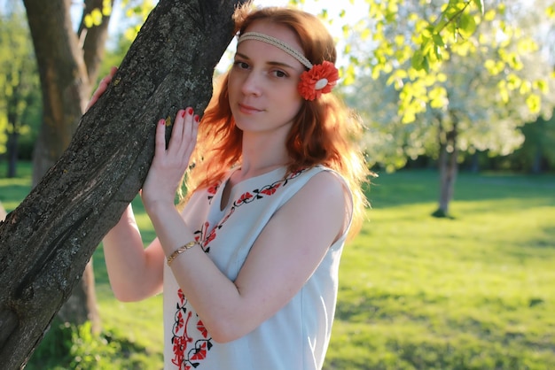 Girl hippie near tree