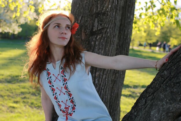 Girl hippie near tree