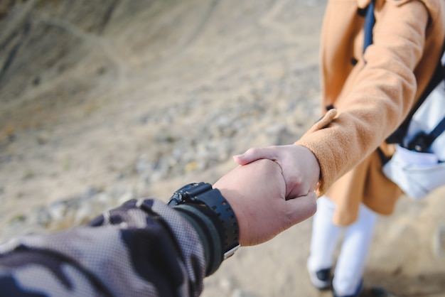 The girl hold the boy hand with soft light