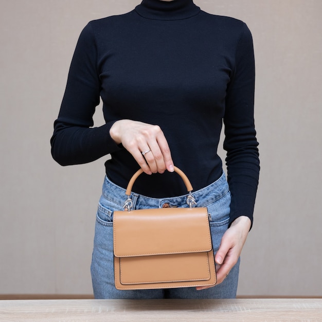 Girl holding bag in hands