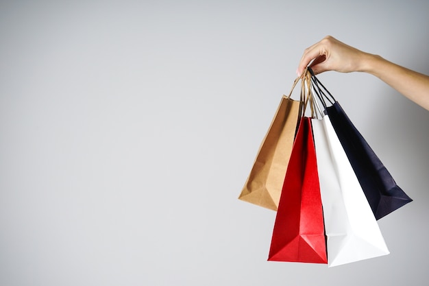 Girl holding bags made of paper