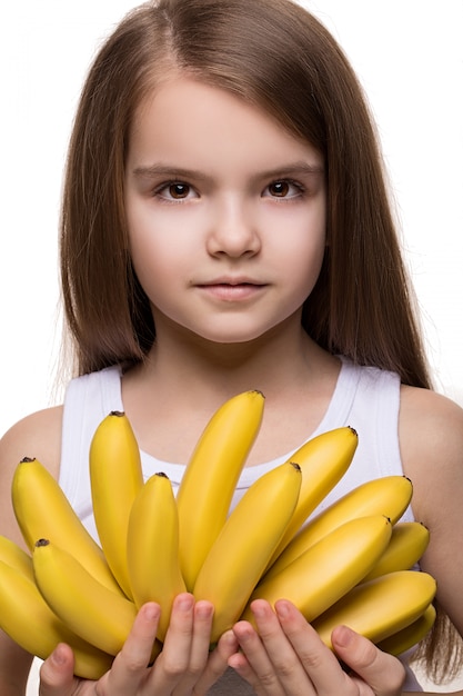 girl holding bananas 