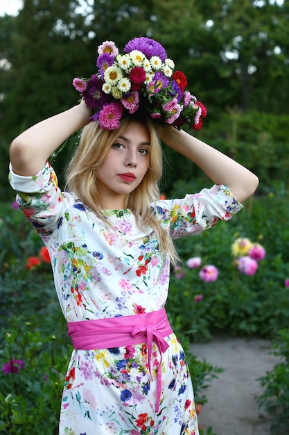 girl holding a bouquet of flowers on her head