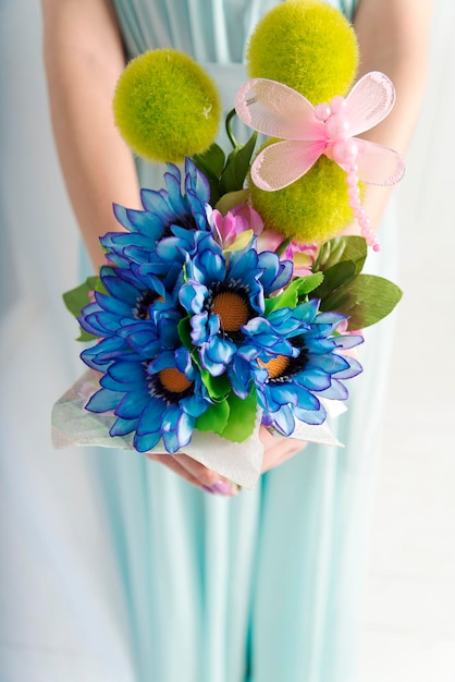 A girl holding a bouquet of flowers