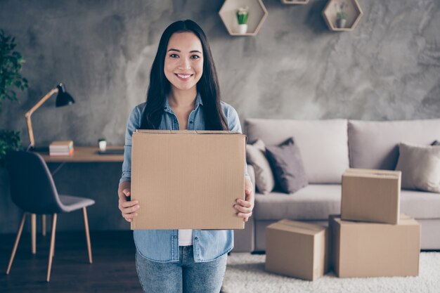 girl holding a box