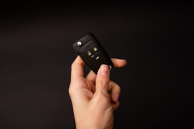 Girl holding car keys in her hand