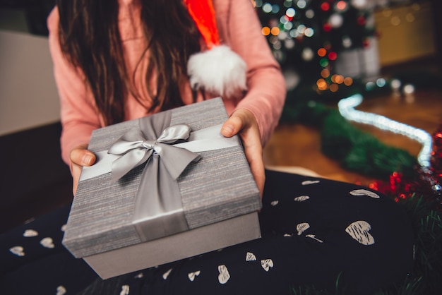 Girl holding christmas gift