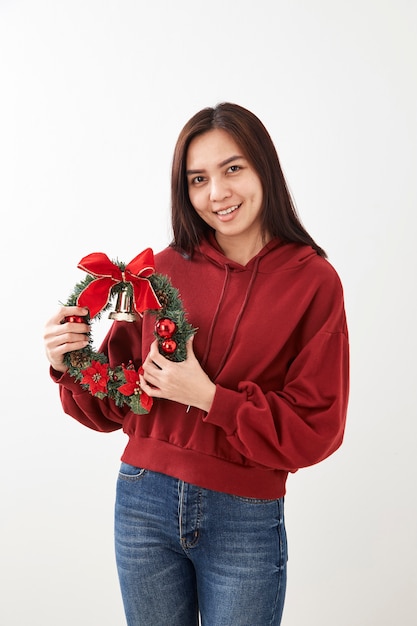 Girl holding Christmas wreath