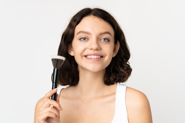 girl holding cosmetics brush