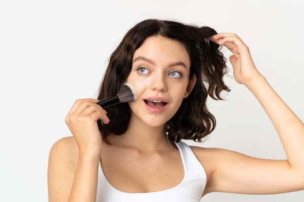 girl holding cosmetics brush