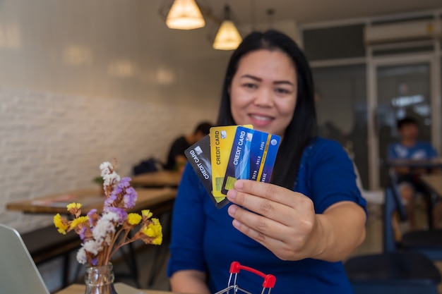 Girl holding credit cards