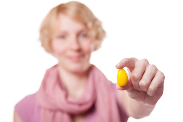 Photo girl holding easter egg in front of the cameras