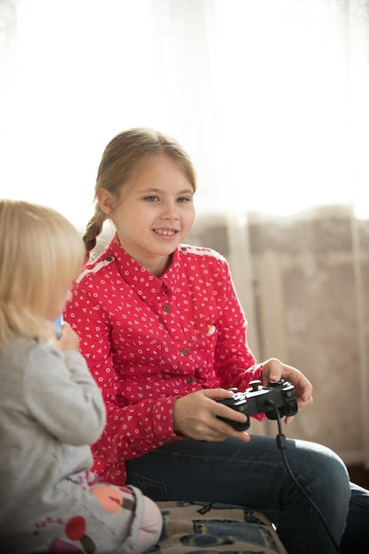 A girl holding a joystick and playing game