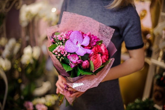 Girl holding a little beautiful bouquet of flowers