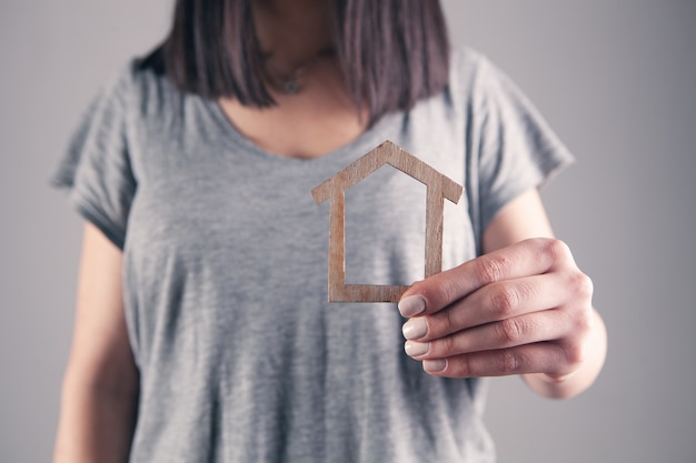 Girl holding a model at home