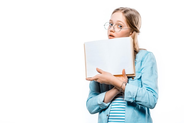 Girl holding open and blank notebook in isolated white background.