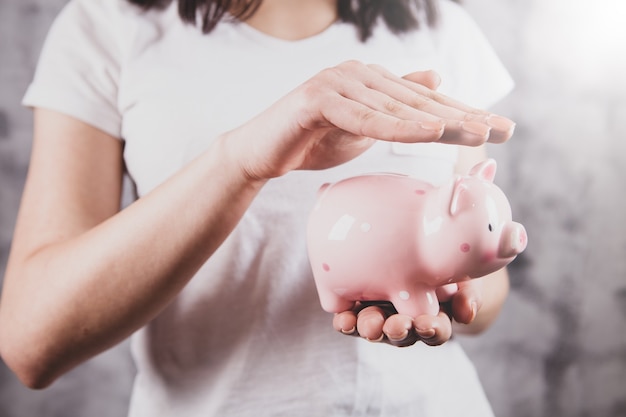 Girl holding a piggy bank