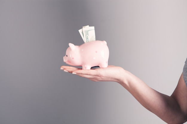 Girl holding a piggy bank