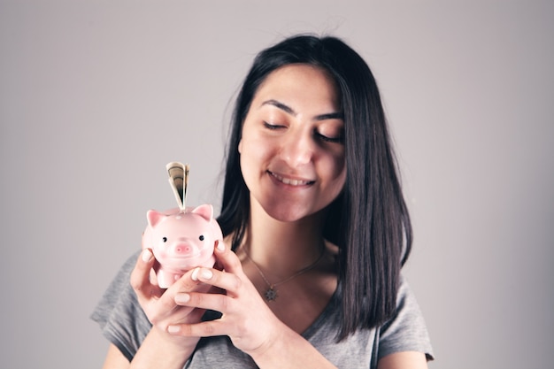 Girl holding a piggy bank