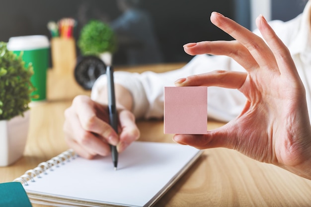 Photo girl holding pink sticker