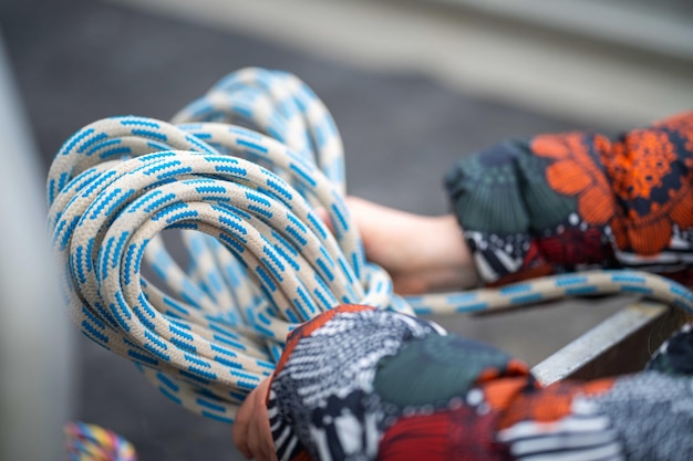 Girl holding rope on a work site in american