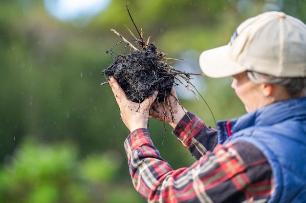 girl holding soil in her hands on a farm in china