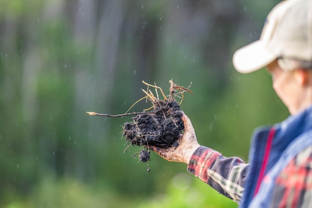 girl holding soil in her hands on a farm in china