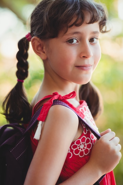 Girl holding strap of her bag