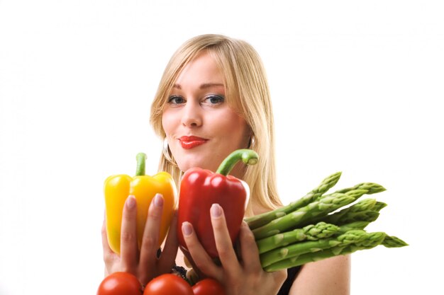 girl holding vegetables