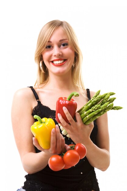 girl holding vegetables