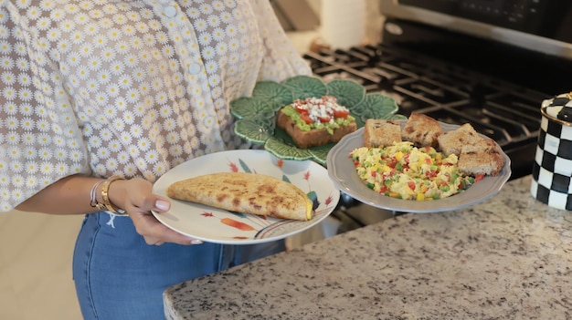 Girl holds breakfast in hands concept food at home