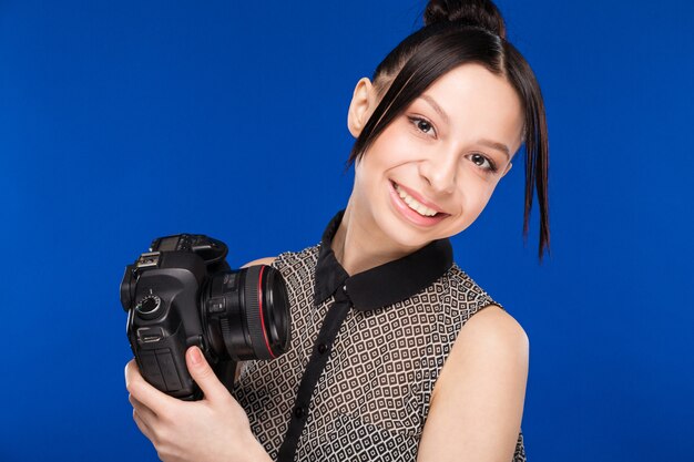 girl holds the camera in hands