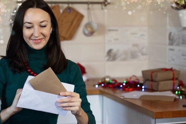 A girl holds a Christmas handmade gift for Christmas. High quality photo