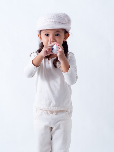 Girl holds an Easter egg