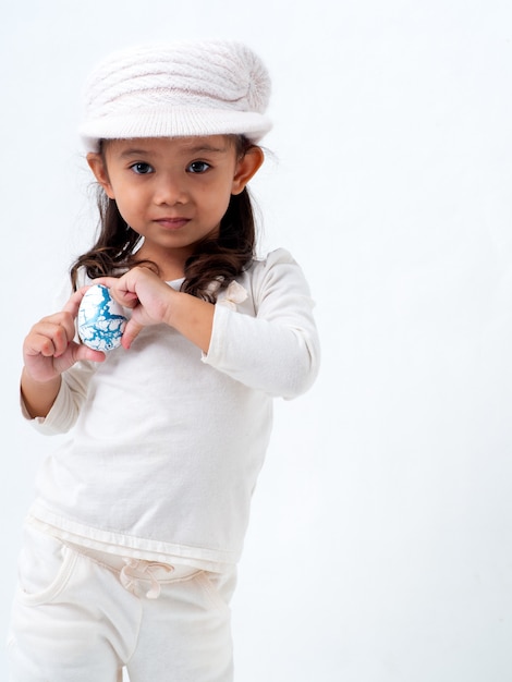 Girl holds an Easter egg