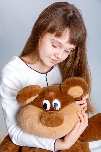 Girl hugging bear