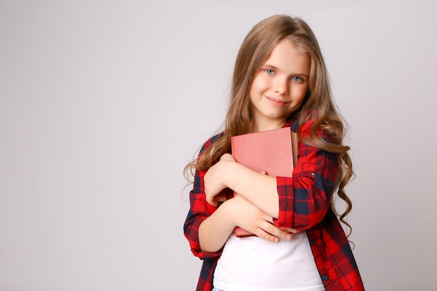 Girl hugging book