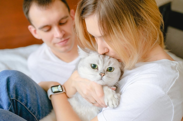 Girl hugging a pet kissing on the head