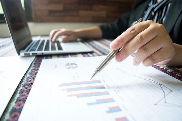 The girl is checking the company's finances to prepare her business development to the Asi