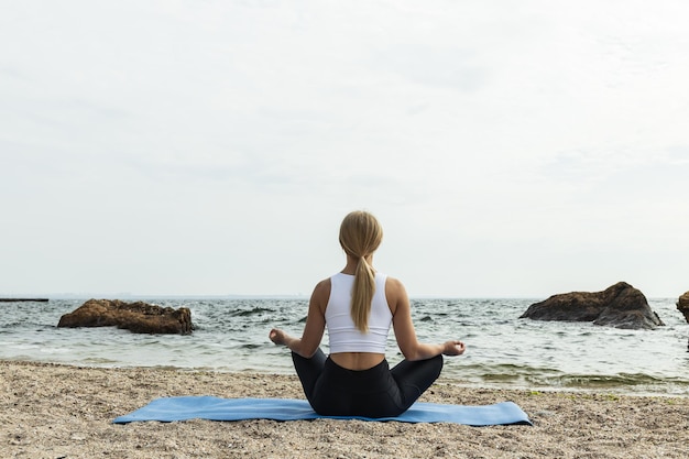 The girl is engaged in meditation in nature