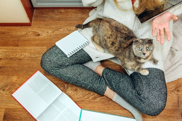 The girl is forced to work at home because of the epidemic of coronavirus.