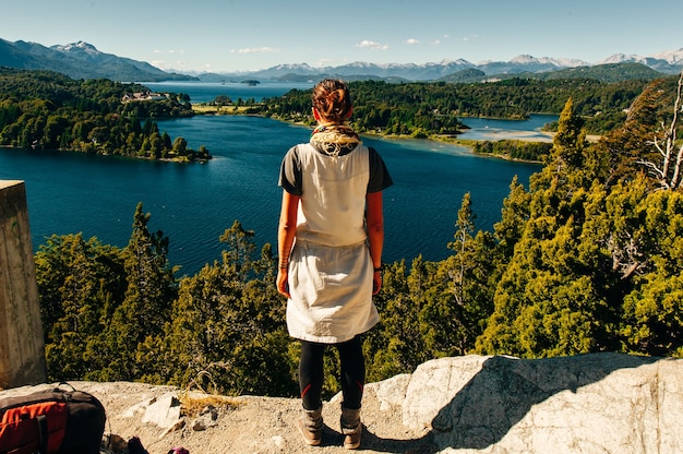 Girl is looking at Nahuel Huapi lake, San Carlos de Bariloche Argentina