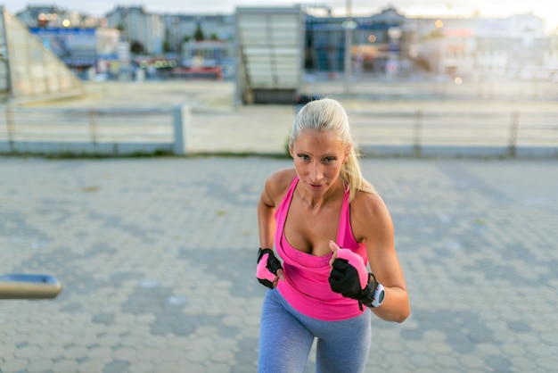 Girl is runing on the city stairs