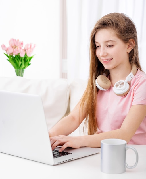 Girl is using laptop at leisure